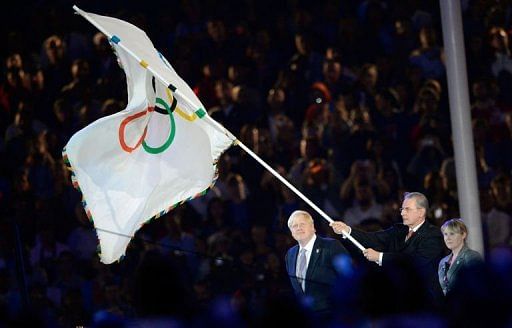 IOC Jacques Rogge prepares to hand over the Olympic flag to Brazil