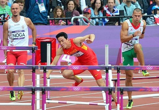 Liu Xiang limped out of the 110m hurdles for the second Games running