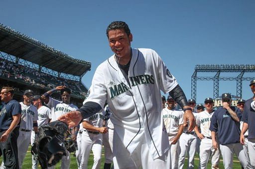 Starting pitcher Felix Hernandez #34 of the Seattle Mariners was dowsed with water after throwing a perfect game