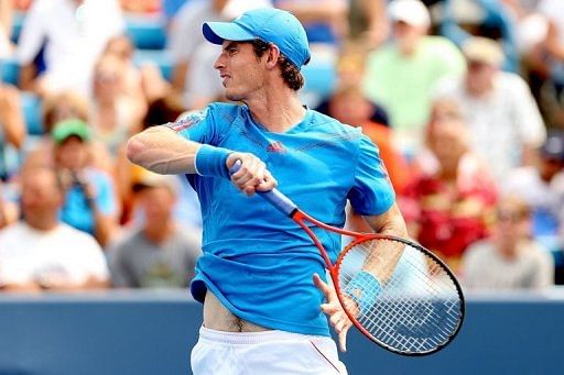 Andy Murray of Great Britain returns a shot to Jeremy Chardy of France