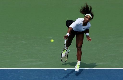 Serena Williams serves against Urszula Radwanska of Poland