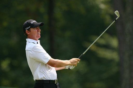 Jimmy Walker watches his second shot on the 18th hole on Friday