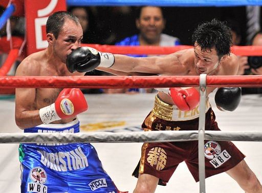 Shinsuke Yamanaka (right) punches Cristian Esquivel of Mexico during their WBC bantamweight title fight in Tokyo in 2011