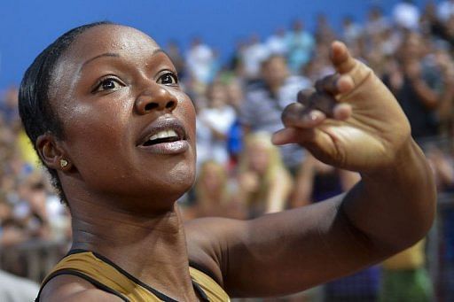 USA&#039;s Carmelita Jeter reacts after winning the women&#039;s 100m race