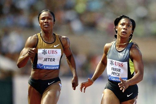 US Carmelita Jeter (L) runs next to Jamaica&#039;s Shelly-Ann Fraser-Pryce