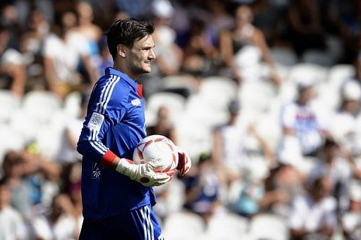 Lyon&#039;s French goalkeeper Hugo Lloris holds the ball during the French L1 football match Lyon vs Troyes in July 2012