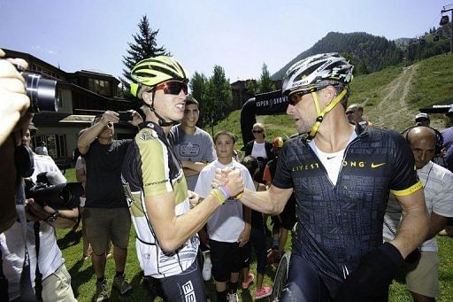 Keegan Swirlbul and Lance Armstrong finish the Power of Four Mountain Bike Race