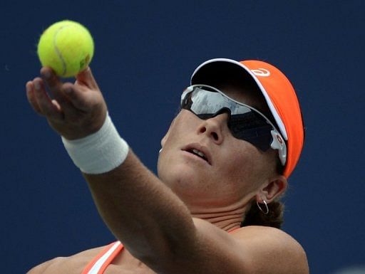 Samantha Stosur of Australia serves to Petra Martic from Croatia