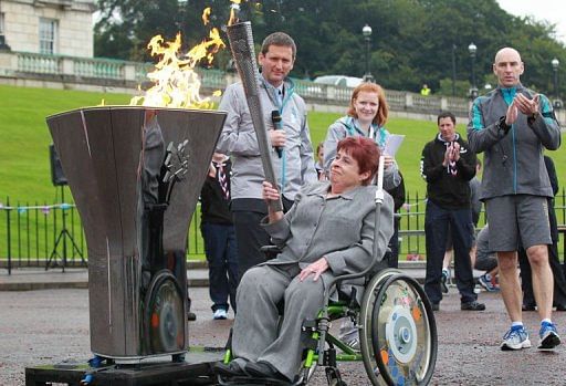 Paralympian athlete Angela Hendra MBE prepares to light the cauldron at Stormont Government buildings in Belfast