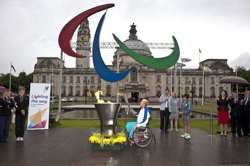 Simon Richardson lights the cauldron with the Welsh Flame at a ceremony for the London 2012 Paralympic Games torch relay