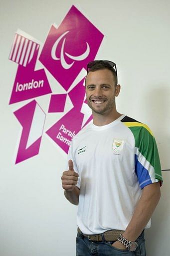 Oscar Pistorius poses during a press conference ahead of the London 2012 Paralympic Games