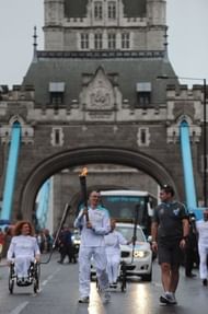 The Paralympic flame is carried across London's Tower Bridge