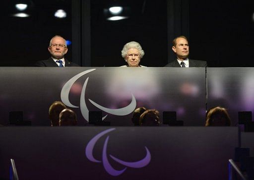 Britain&#039;s Queen Elizabeth II (C) watches the show