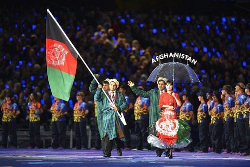 Members of Afghanistan&#039;s delegation parade during the opening ceremony of the London 2012 Paralympic Games