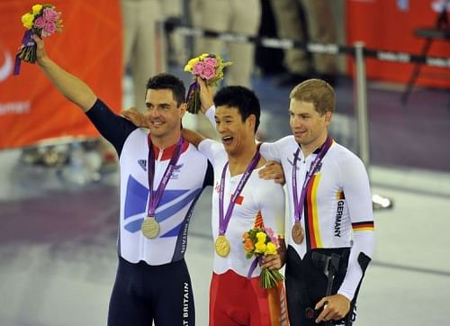 Britain's Mark Lee Colbourne (L), China's Li Zhang Yu (C) and Germany's Tobias Graf (R) pose