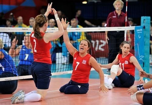 Great Britain's Martine Wright (2nd R) celebrates a point with team-mate Victoria Widdup