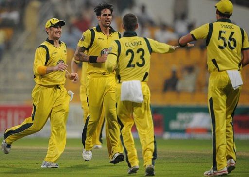 Australian cricketers celebrate after the dismissal of Pakistani batsman Nasir Jamshed