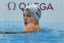 US swim star in final but doubts remain