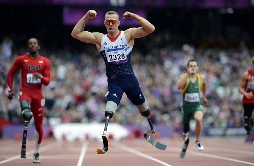 Richard Whitehead (centre) crosses the finish line during the London 2012 Paralympic Games