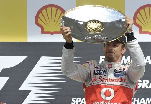 Button back on top with victory for McLaren