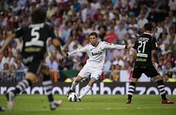 Adriano strike sinks Valencia to keep Barca top