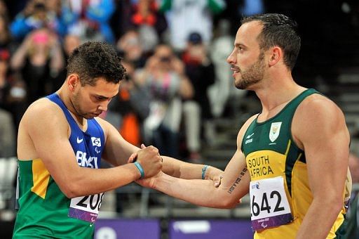 Oscar Pistorius (right) shakes hands with Alan Oliveira after the race. Pistorius said: 