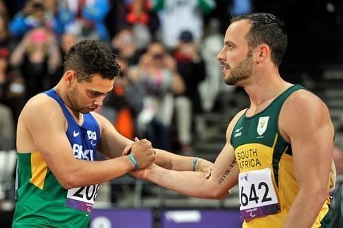 South Africa's Oscar Pistorius (R) shakes hands with Brazil's Alan Oliveira