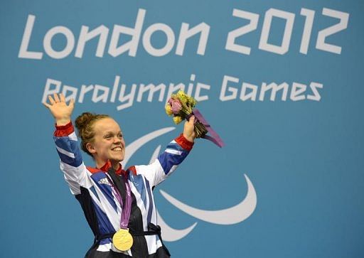 Great Britain&#039;s Eleanor Simmonds celebrates with her gold medal