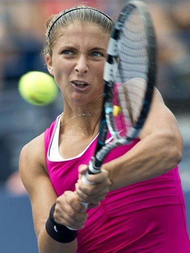 Sara Errani of Italy hits a return to Angelique Kerber of Germany