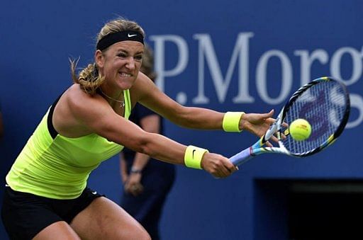 Victoria Azarenka of Belarus returns against Samantha Stosur of Australia