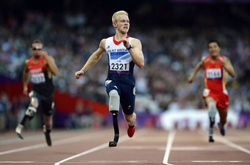 Britain's Jonnie Peacock powers home to win the men's 100m T44 heat 1