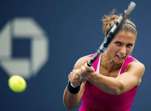 Sara Errani of Italy hits a return to Roberta Vinci of Italy