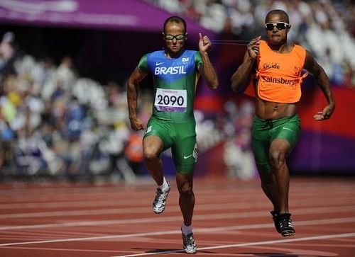 Brazil's Daniel Silva (left) and guide Heitor de Oliveira Sales compete in the men's 200m T11 semi-final