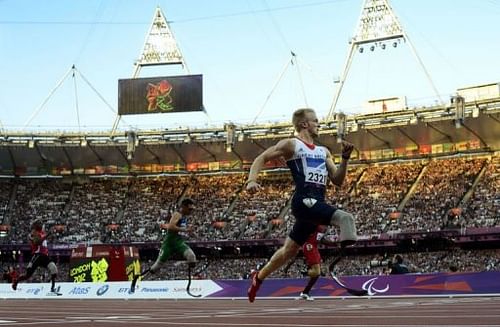 Britain's Jonnie Peacock powers home to win the men's 100m T44 heat 1