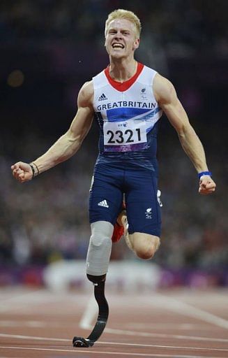 Britain&#039;s Jonnie Peacock crosses the line first to win the men&#039;s 100m T44 final