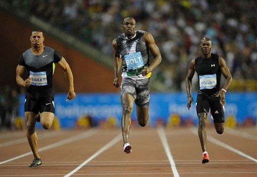 Jamaica&#039;s Usain Bolt (C) competes during the men&#039;s 100m