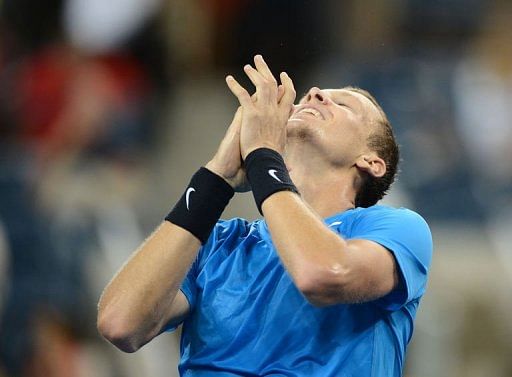 Czech Tomas Berdych celebrates winning against Switzerland&#039;s Roger Federer