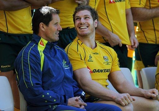 The losses have placed an enormous amount of pressure on Australia coach Robbie Deans (L)