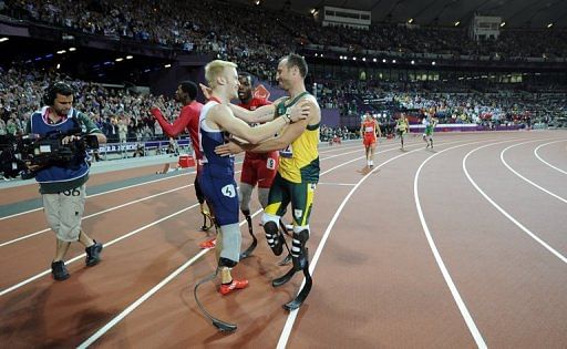 Oscar Pistorius (right) is determined to go out with gold in the T44 400m after defeat in the 200m and 100m