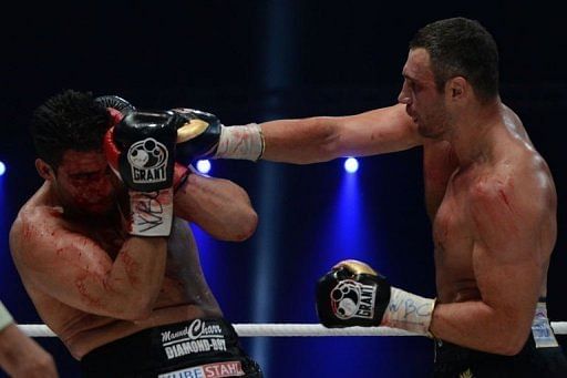 Vitali Klitschko (R) fights against Manuel Charr