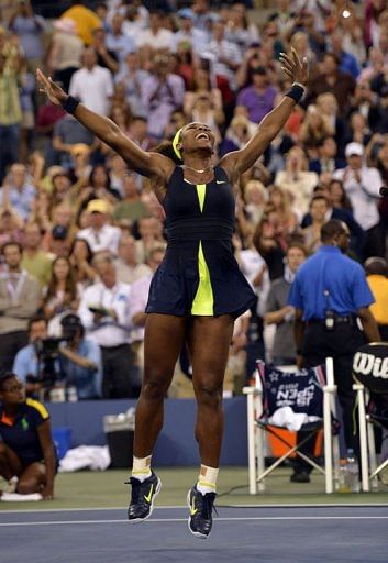 Serena Williams celebrates defeating Victoria Azarenka