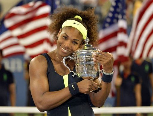 Serena Williams of the US poses with the trophy