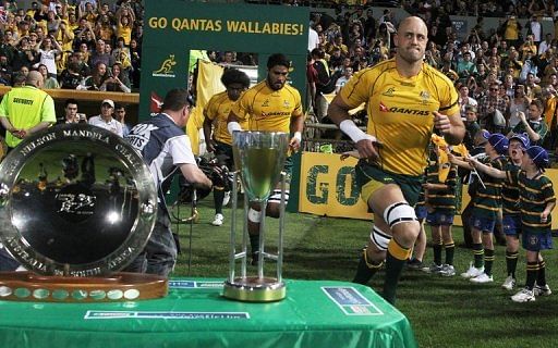 Australian lock Nathan Sharpe postponed his retirement from international rugby