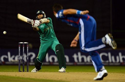 South African batsman Hashim Amla (L) plays a shot