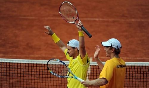 Chris Guccione (R) and Lleyton Hewitt of Australia