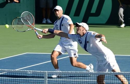 Israel's Jonathan Erlich (R) and his partner Andy Ram (L) try to return a shot