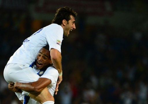 Inter Milan&#039;s Diego Milito (Top) celebrates with Alvaro Pereira after scoring