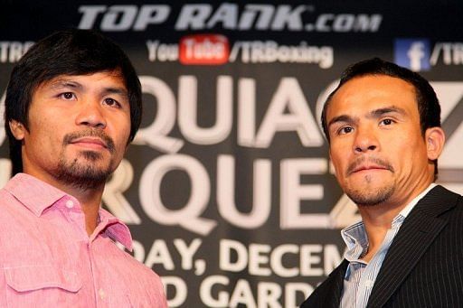 Manny Pacquiao (L) and Juan Manuel Marquez kicked off a three-city promotional tour on Monday