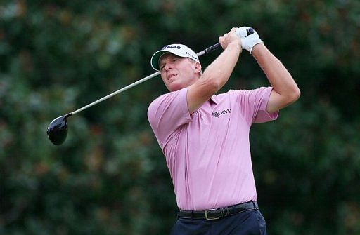 Steve Stricker watches his tee shot on the fifth hole