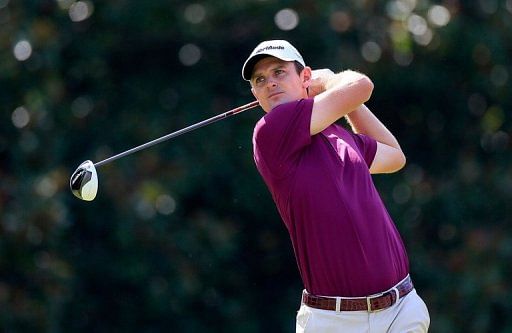 Justin Rose of England watches his tee shot on the eighth hole during the second round